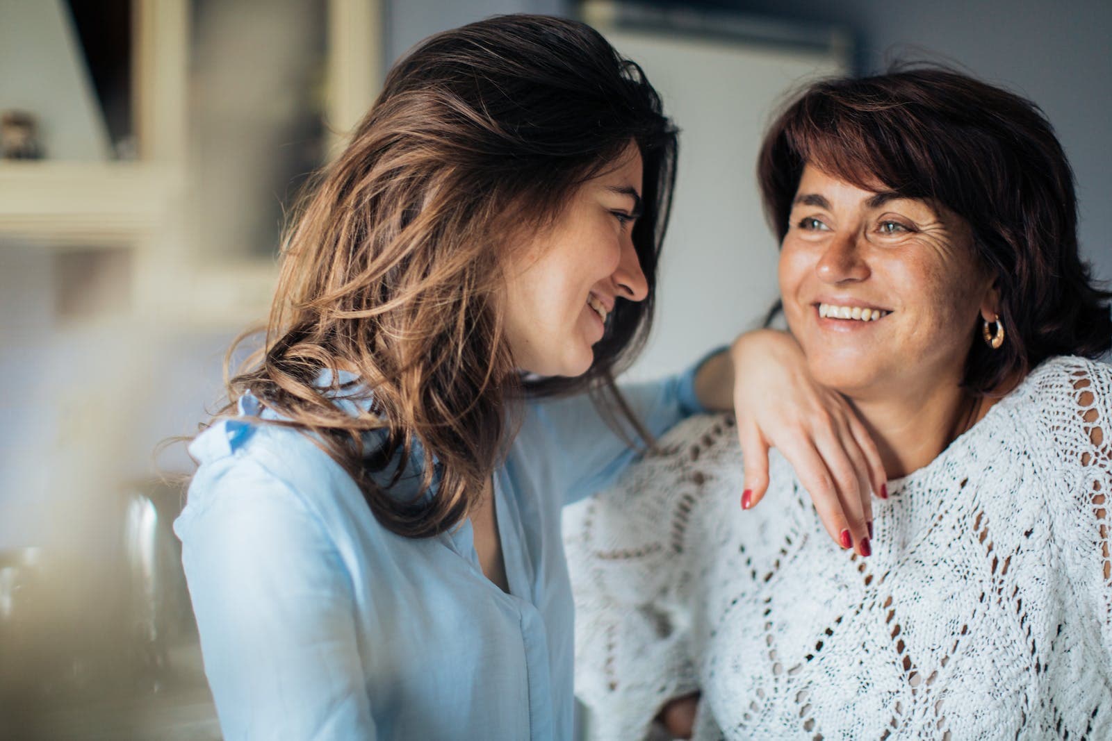 Mother and daughter Smiling At Each Other