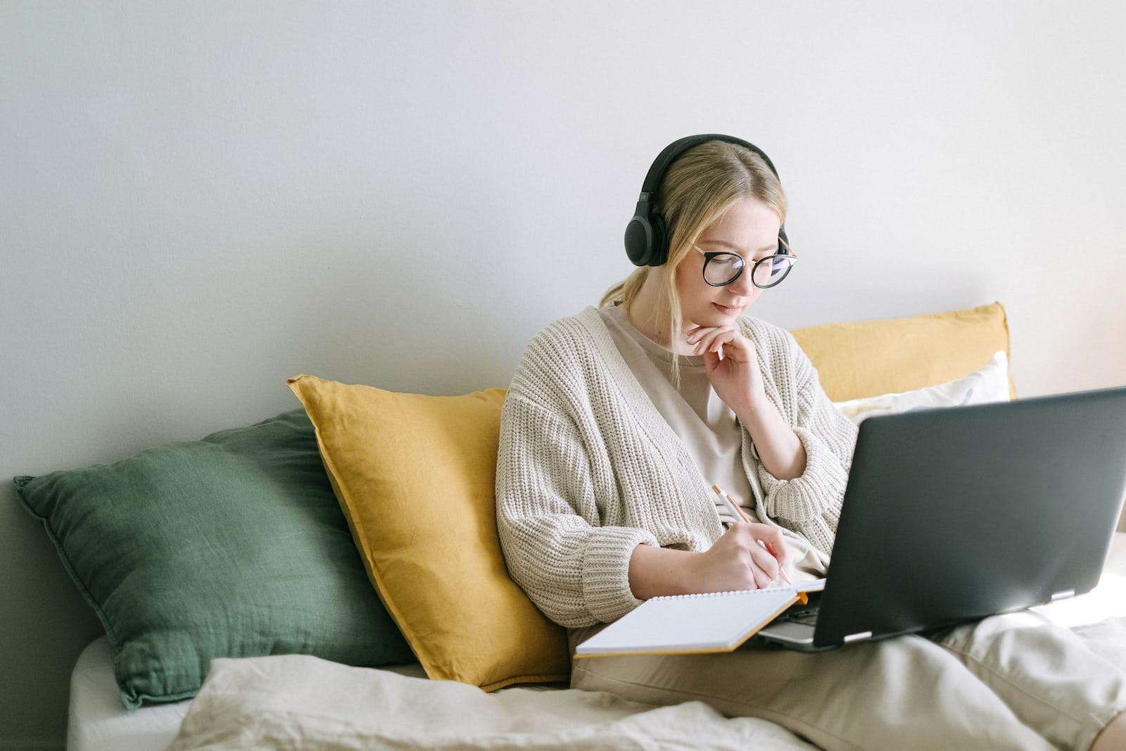woman reads on a forum on her couch