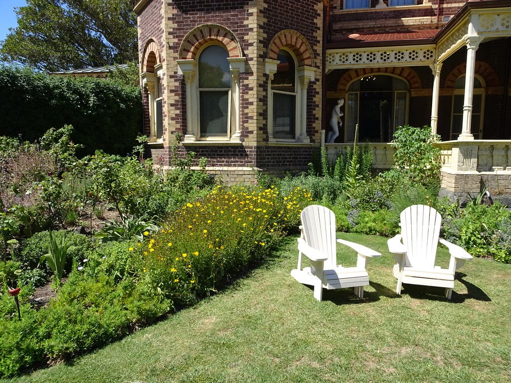 a mansion with a south oriented sunny garden