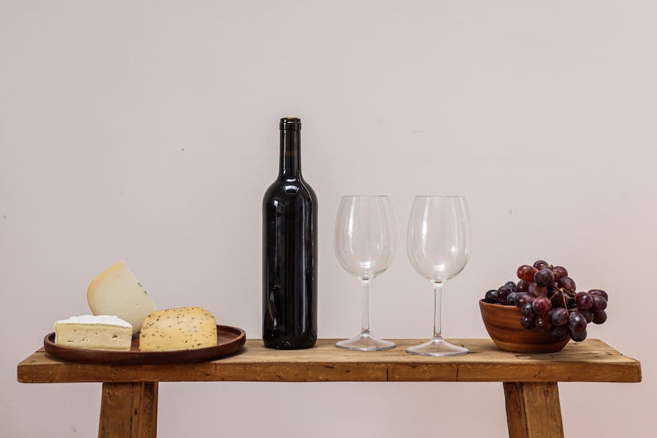 Wine Bottle and Wine Glasses on a Brown Wooden Table