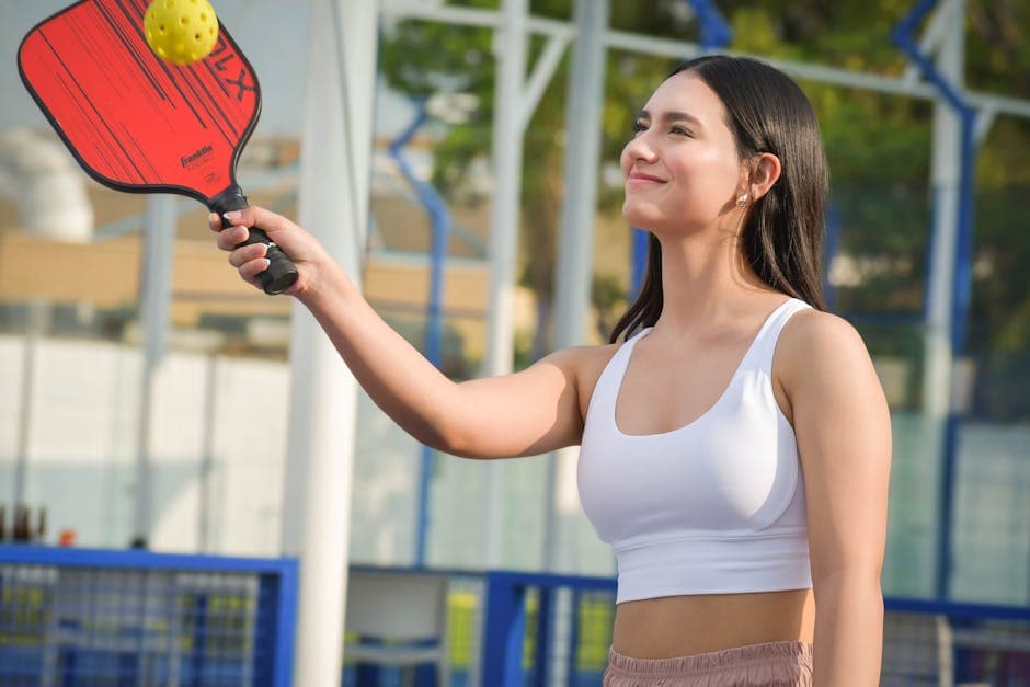 Woman with a Table Tennis Racket in her Hand 