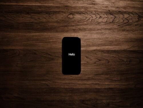 Turned-on Black Iphone 7 Displaying Hello
