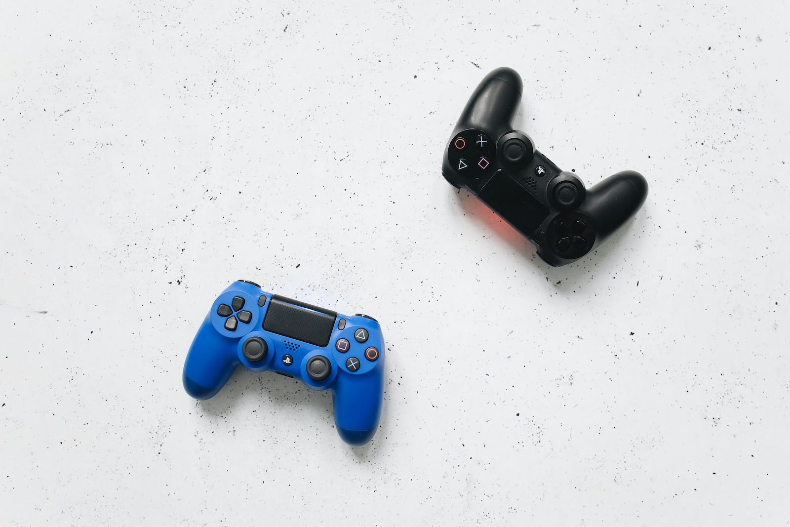 Playstation Controllers on a White Surface