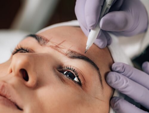 Close-up of Beautician Doing Permanent Brow Tattoo (Micro Blading)