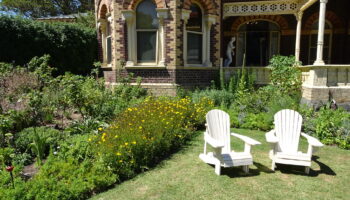 a mansion with a south oriented sunny garden