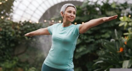 Woman Doing Warrior Pose at Yoga Retreat