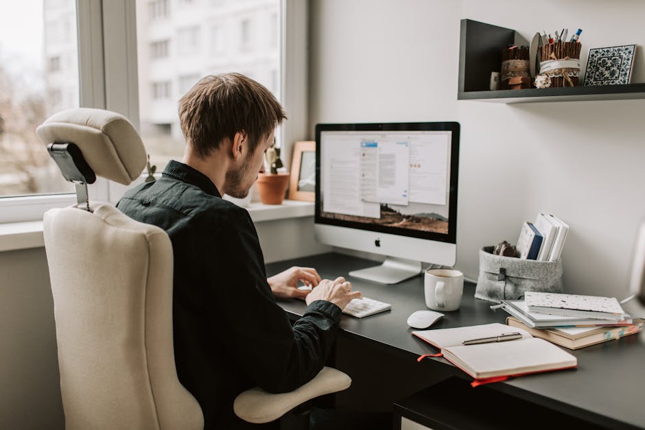 Photo Of Man Using Computer