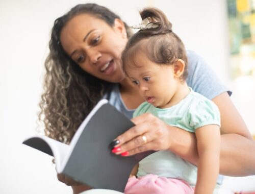 Mother and Baby Girl Reading the Book Together