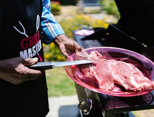 Person Holding a Raw Meat