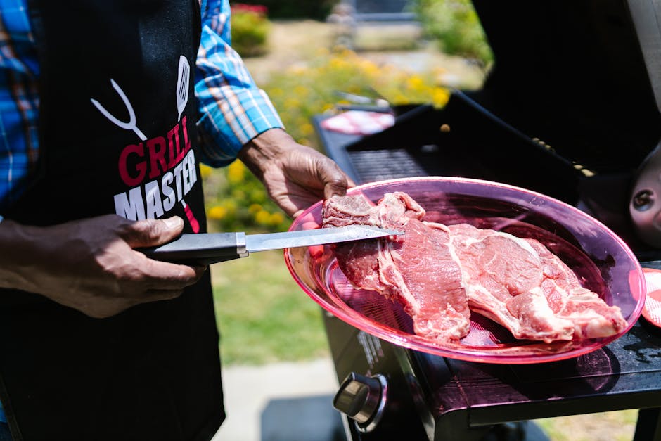 Person Holding a Raw Meat