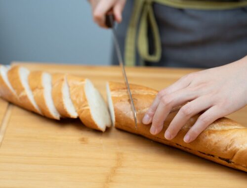 Hands Cutting Baguette