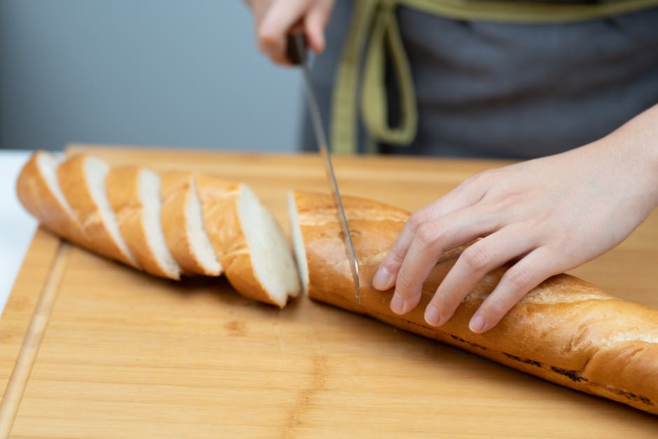 Hands Cutting Baguette