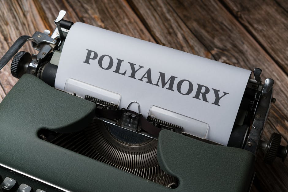 A typewriter with the word polyamory written on it