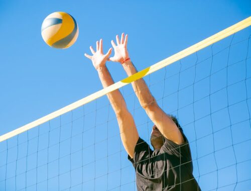 Man Blocking a Ball Over the Net